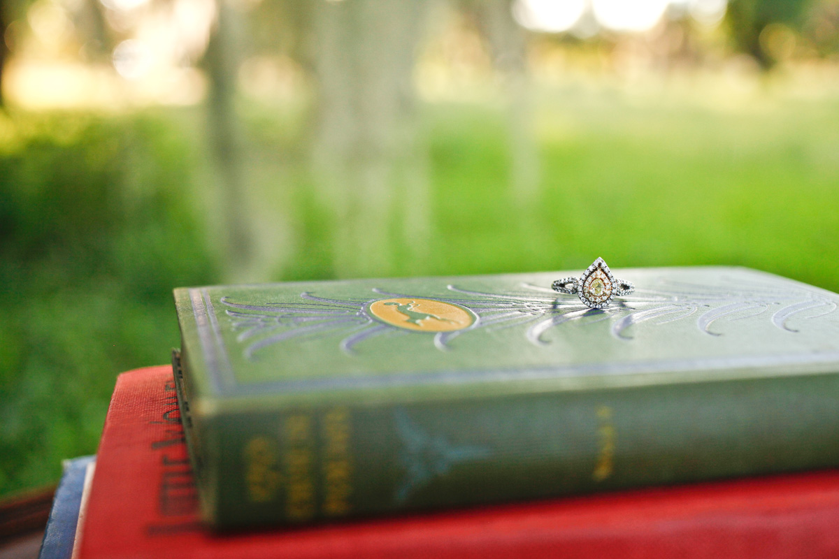 Engagement Ring on Vintage Books | The Majestic Vision Wedding Planning | Riverbend Park in Palm Beach, FL | www.themajesticvision.com | Krystal Zaskey Photography