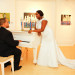Romantic Bridal Portrait with Groom Serenading the Bride at 32 East in Palm Beach, FL thumbnail