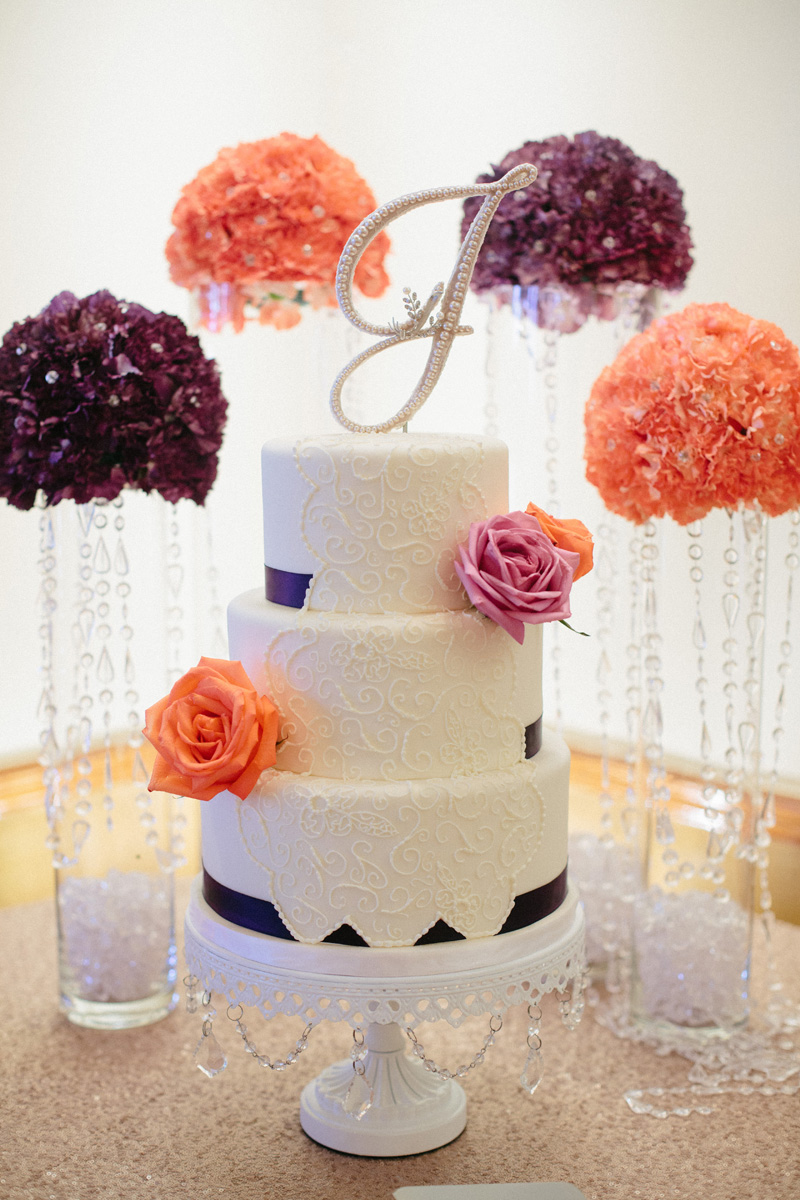 Elegant Wedding Cake with Purple Roses and Coral Roses | The Majestic Vision Wedding Planning | Sailfish Marina in Palm Beach, FL | www.themajesticvision.com | Robert Madrid Photography