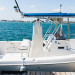 Elegant Waterfront Wedding with the Wedding Dress Hanging from a Boat at Sailfish Marina in Palm Beach, FL thumbnail