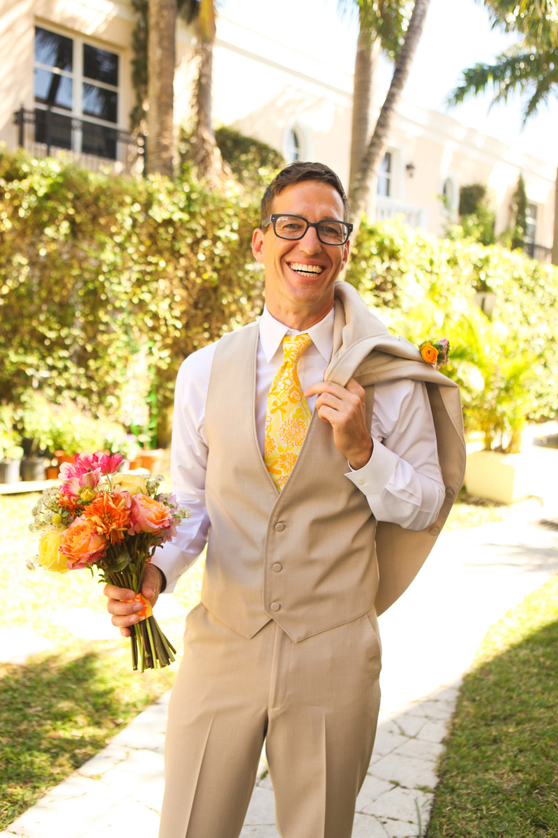 Handsome Groom with Elegant Lilly Pulitzer Inspired Bridal Bouquet with Orange, Yellow and Pink Flowers | The Majestic Vision Wedding Planning | The Colony Hotel in Palm Beach, FL | www.themajesticvision.com | Krystal Zaskey Photography