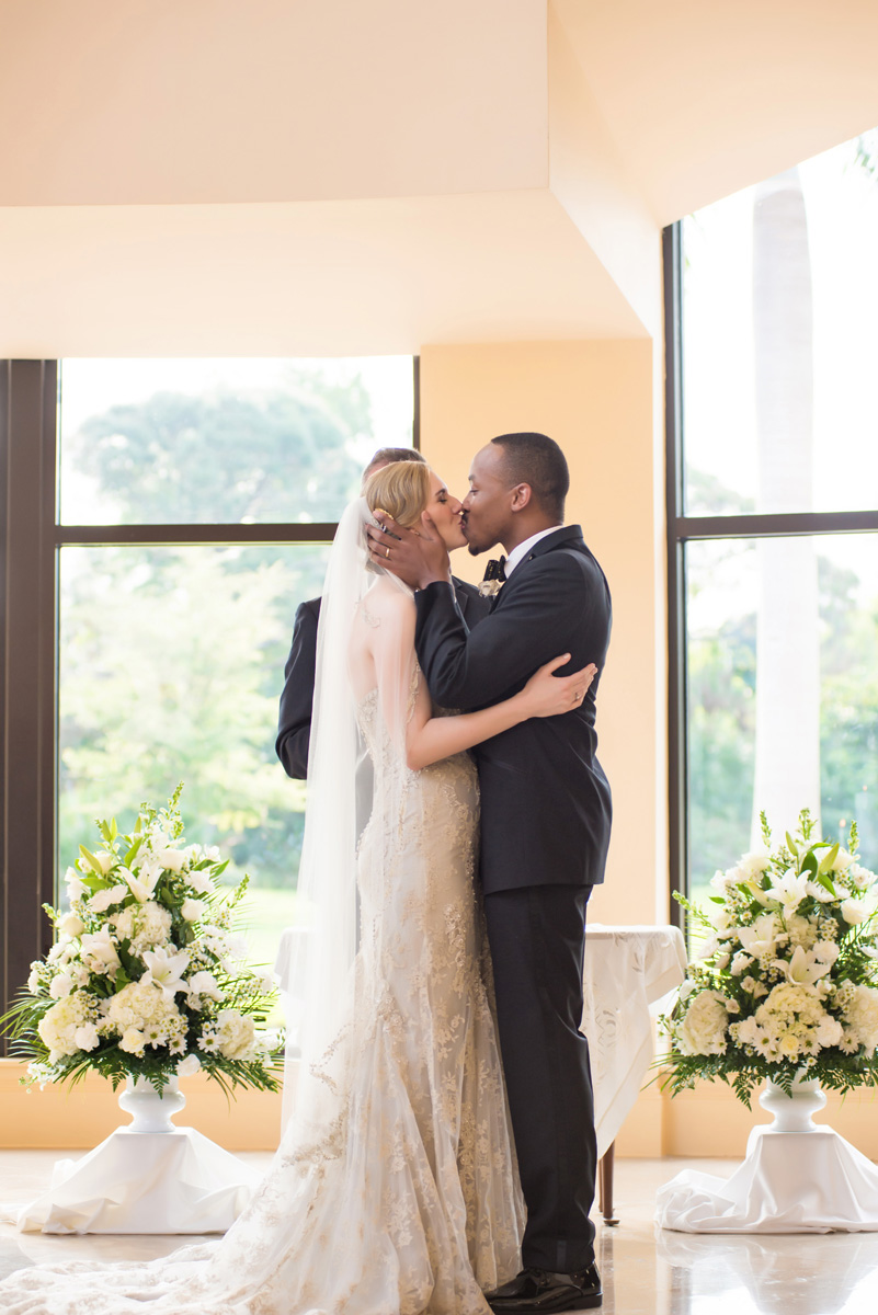 Elegant Interracial Couple First Kiss | The Majestic Vision Wedding Planning | The Borland Center in Palm Beach, FL | www.themajesticvision.com | Enduring Impressions Photography