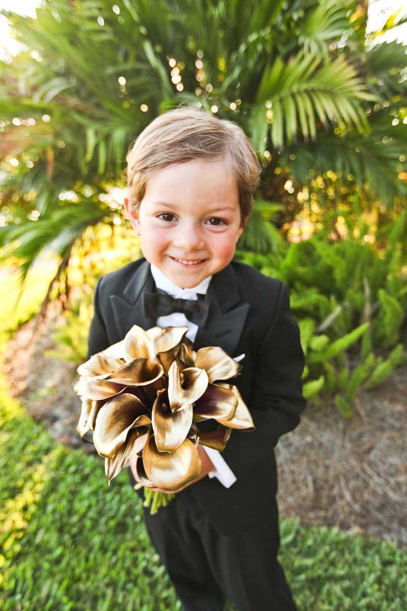 Adorable Ring Bearer Holding Modern Bridal Bouquet with Gold Tulips Wrapped in Black and White Fabric | The Majestic Vision Wedding Planning | Breakers West in Palm Beach, FL | www.themajesticvision.com | Krystal Zaskey Photography